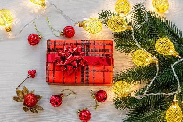 The view from the top Christmas gift in red box with glowing lights on a white background (Flip 2019)