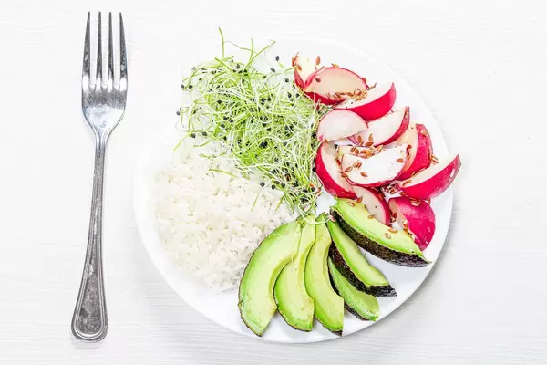 The view from the top rice with slices of radish, avocado and micro-greens onions (Flip 2019)