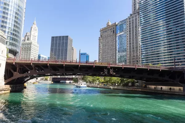 The Wabash Avenue Bridge seen from a boat on the Chicago River on a sunny day