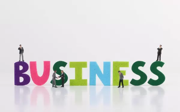 The word Business with group of businessman on white background