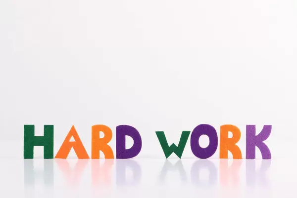 The word Hard Work on white background