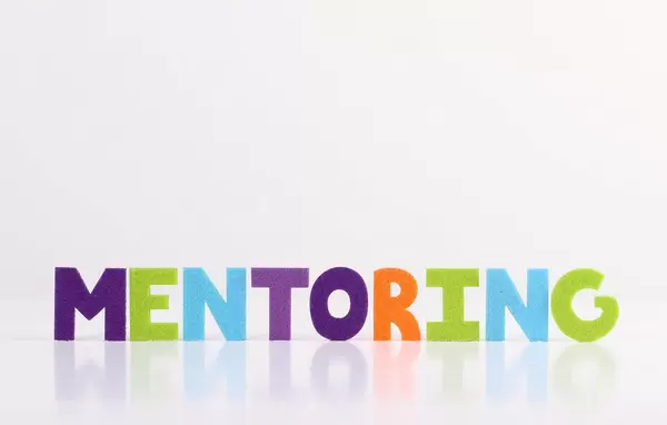 The word Mentoring on white background