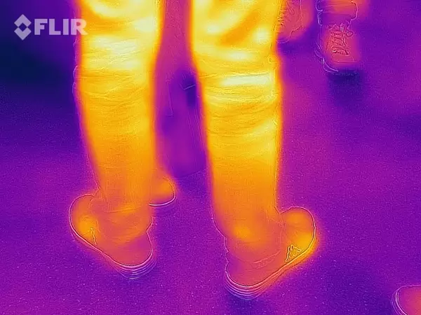 Thermal image of a passerby's legs - FLIR infrared camera / iPhone
