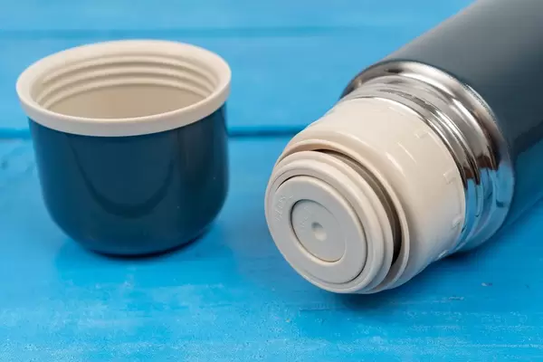 Thermo Bottle on the wooden table