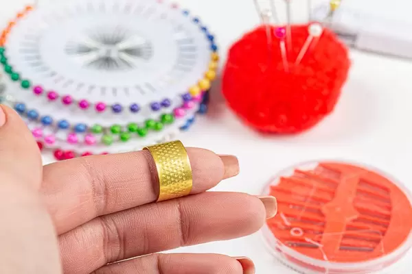 Thimble for sewing on the finger