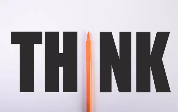 Think text with orange pen