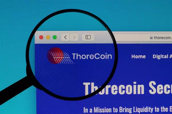 ThoreCoin logo under magnifying glass