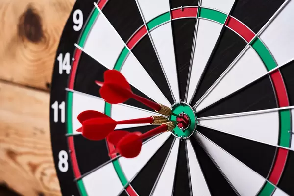 Three arrows in the centre of a dart board