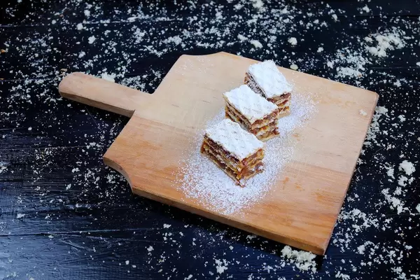 Three caramel cakes on a black wooden table, home made cake (Flip 2019)