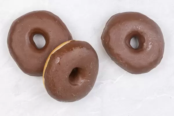 Three Chocolate Donuts on the table