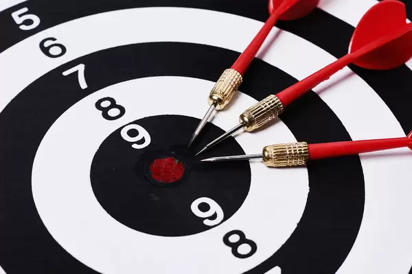 Three darts on dart board