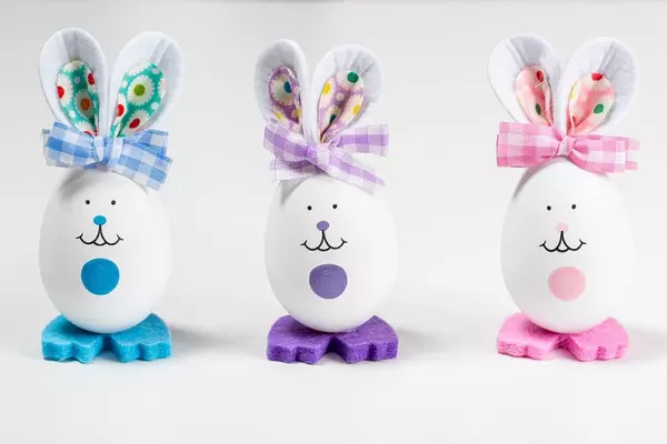 Three Easter bunnies made from eggs on a white background