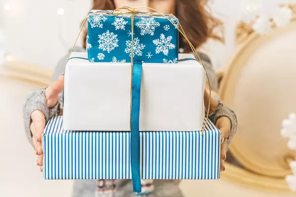 Three gifts in hands, close-up
