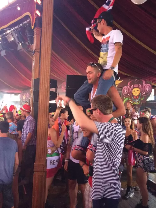 Three guys sitting on each other's necks - Tomorrowland music festival 2014