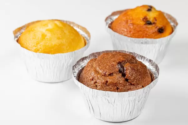 Three muffins with different fillings on a white background (Flip 2019)