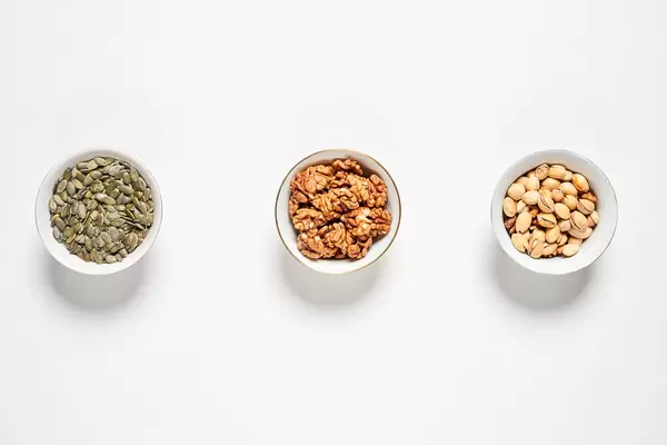 Three plates with nuts and seeds