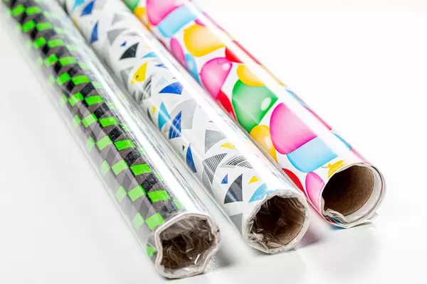 Three rolls of multi-colored gift wrapping paper (Flip 2019)