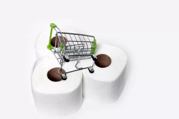 Three rolls of toilet paper and shopping trolley