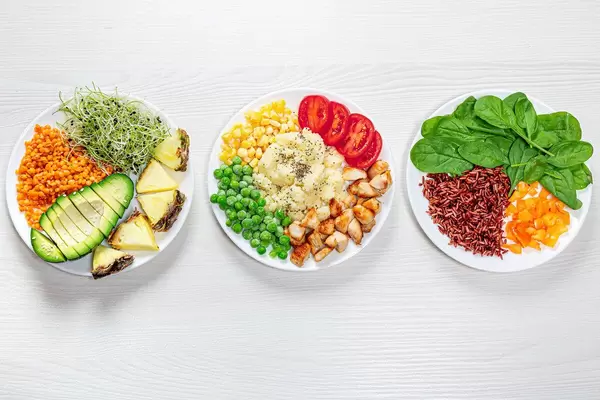 Three variants of diet lunch on a white wooden background. Top view