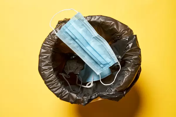 Throwing medical coronavirus face mask