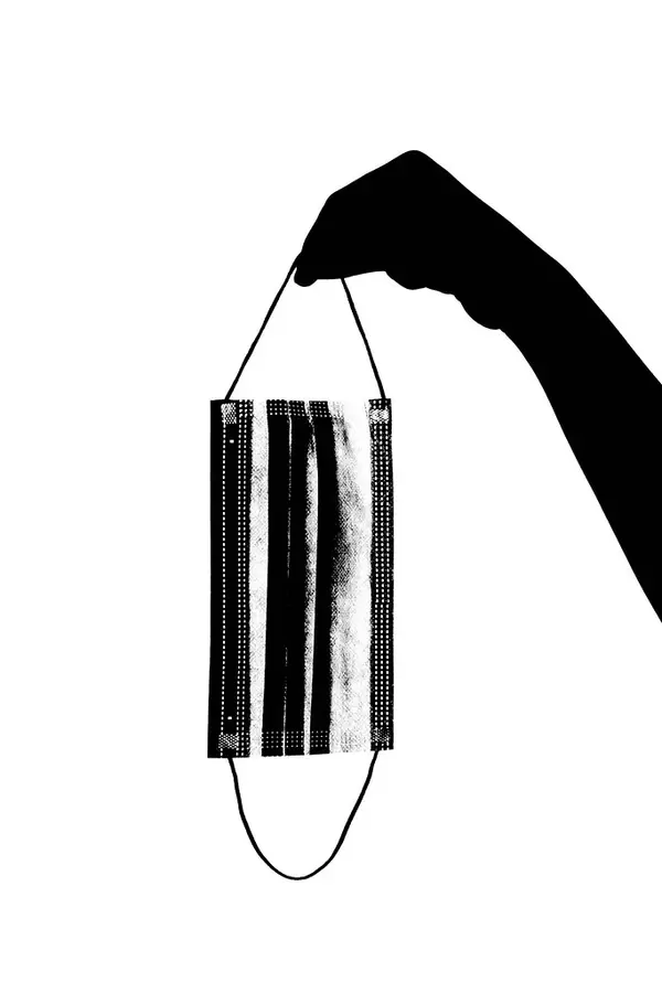 Throwing used medical face mask