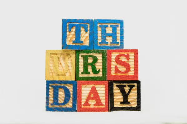 Thursday text formed on wooden blocks