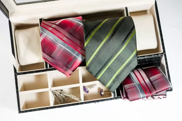 Ties, cufflinks, and pocket square in box organizer