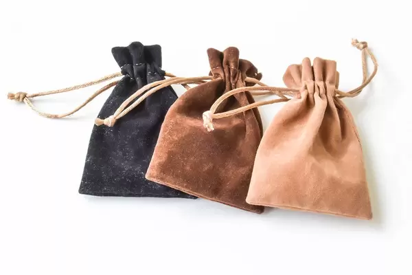 Tiny leather bags in three different colors