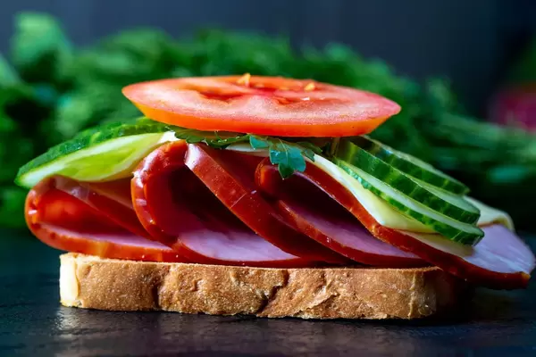 Toast with ham, cheese, cucumbers and tomatoes