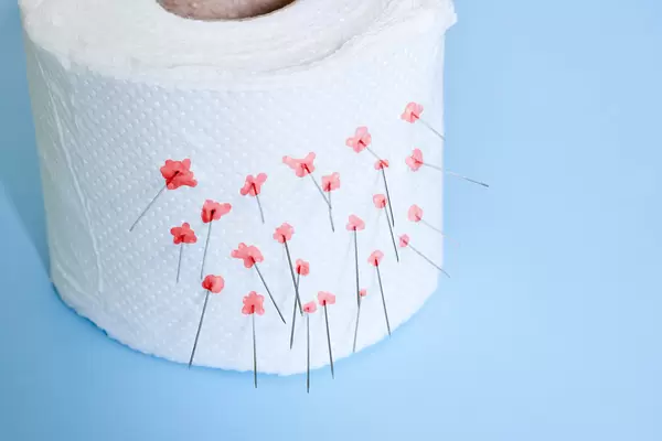 Toilet paper with nails and blood points