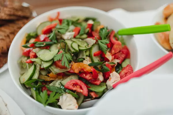 Tomato And Cucumber Salad In Bowl