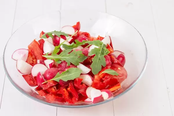 Tomato Radishes Rukola and Cheese Salad in the bowl (Flip 2019)