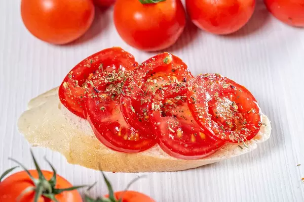 Tomato sandwich on white wooden background (Flip 2019)