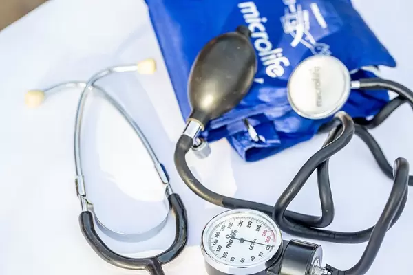 Tonometer with stethoscope on white background