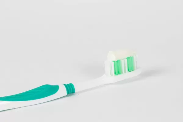 Toothbrush with white toothpaste