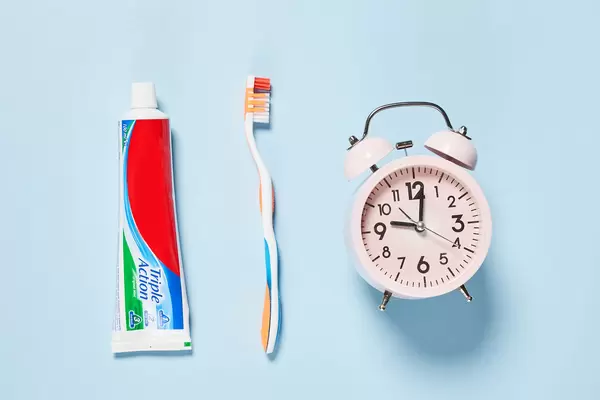 Toothpaste, toothbrush and alarm clock