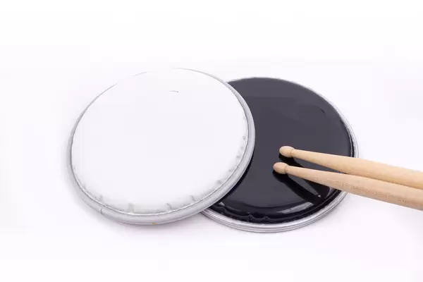 Top of the Snare Drum called Butter Head above white background with Drumsticks