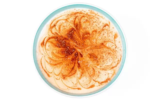 Top view, a bowl of cottage cheese and yogurt dessert with cocoa (Flip 2020)