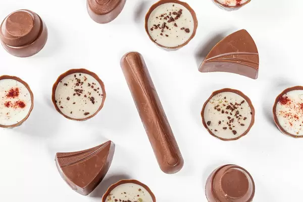 Top view assorted chocolates on a white background (Flip 2019)