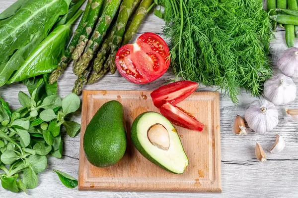 Top view, background of fresh vegetables with water drops