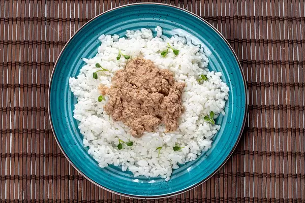 Top view boiled rice with tuna in green plate (Flip 2019)
