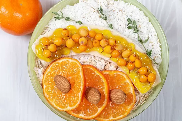 Top view breakfast with oatmeal, fruit and coconut (Flip 2019)