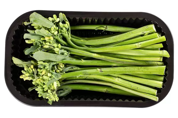 Top view, broccolini in black plastic container