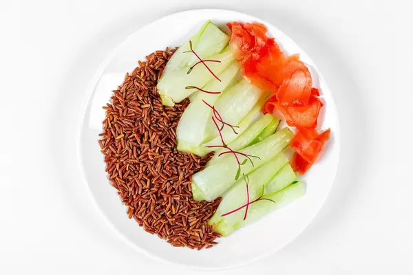 Top view, brown rice with pak choy baby cabbage and pickled ginger (Flip 2020)