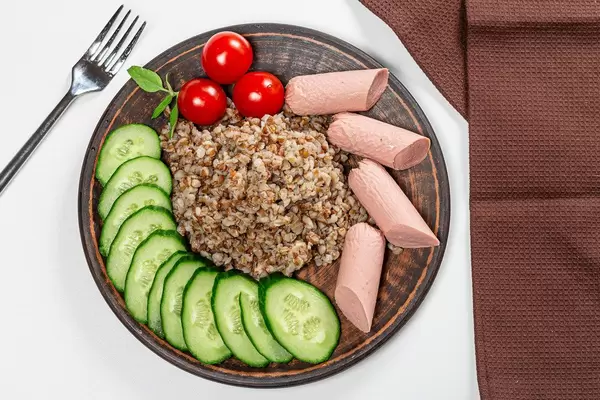 Top view buckwheat with sausages and vegetables (Flip 2019)