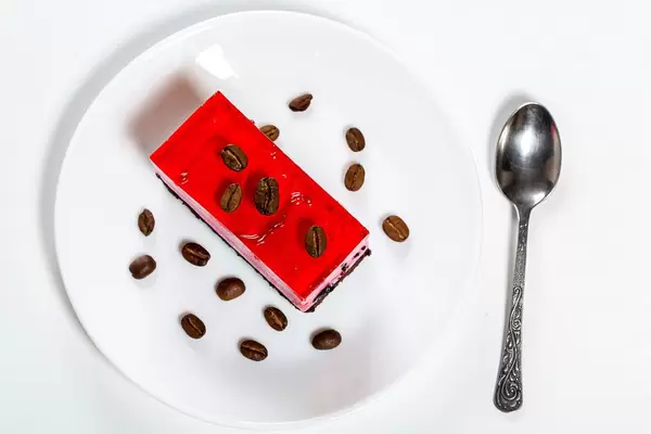 Top view chocolate and strawberry cake with coffee grains