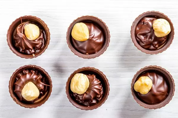 Top view chocolates with whole hazelnuts (Flip 2019)