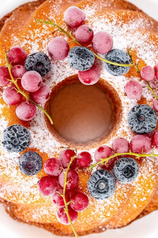 Top view, cupcake with powdered sugar and berries