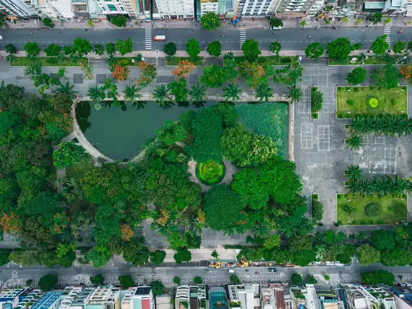 Top View Drone Photo of 23/9 City Park between Le Lai and Pham Ngu Lao Street with a small Lake and many Trees in Ho Chi Minh City, Vietnam