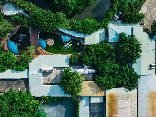 Top View Drone Photo of the abandoned KizCiti Water Park with Playground Airplane and Swimming Pools within Khanh Hoi Park in Ho Chi Minh City, Vietnam